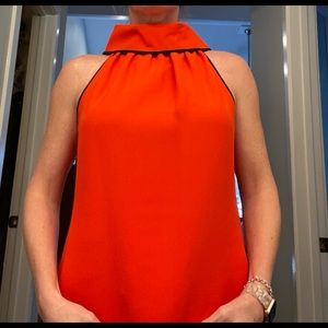 Red cowl neck sleeveless top w. Navy trim. Gold buttons on back